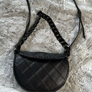 Tory Burch Mini Fleming Soft Crescent Bag in Black.